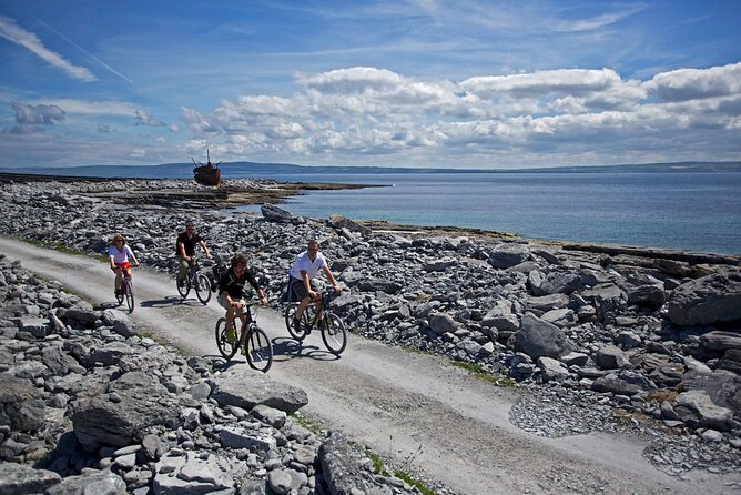 Aran Islands Bike Tour with Tea & Scones - Day Trip to Inisheer from Doolin - Cycling past stone walls, graves, and a shipwreck